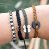 Black Wayta Sweet Caramel fair trade bracelets on wrist
