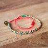 Carnival Deep Watermelon Bracelets With A Cause on wood