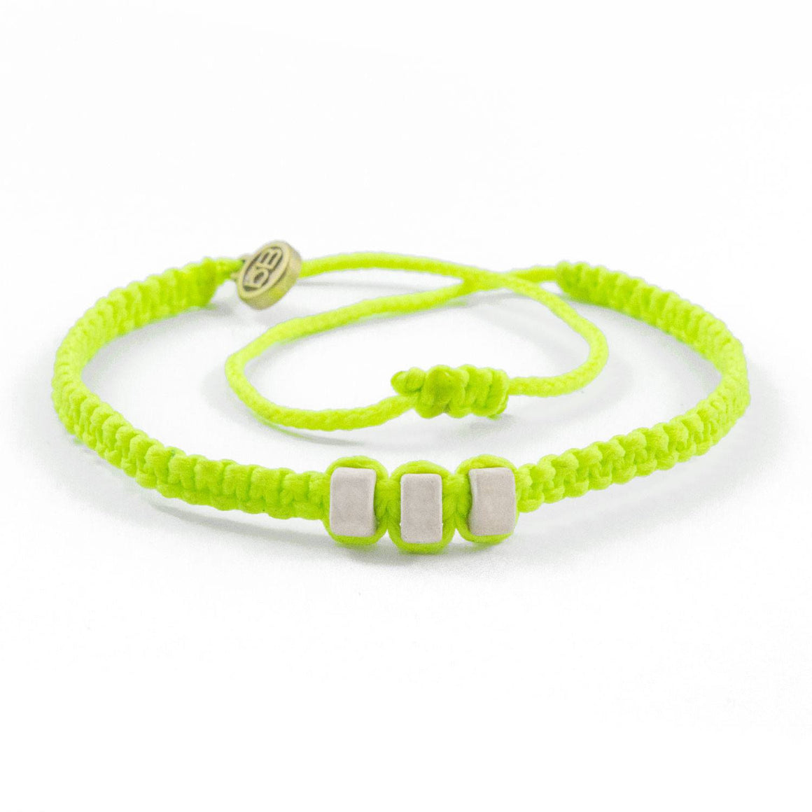 White Chasqui Electric Yellow bracelets that help children cover
