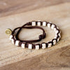 White Andes Chocolate Brown macrame artisan bracelets on wood