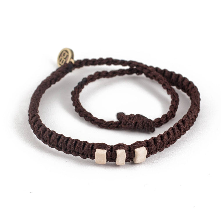 White Chasqui Chocolate Brown bracelets that help children cover