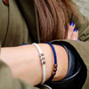 Brown Chasqui Dark Blue bracelets that help children on wrist