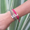 White Chasqui Arabic Camel bracelets that help children on wrist