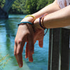 White Chasqui Electric Yellow bracelets that help children on wrist