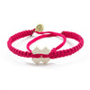 White Tinkus Strawberry Pink donation bracelets cover