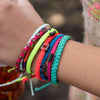 Black Andes Strawberry Pink macrame artisan bracelets on wrist
