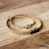 Black Chasqui Arabic Camel bracelets that help children on wood