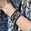 Black Chasqui Urban Khaki bracelets that help children on wrist