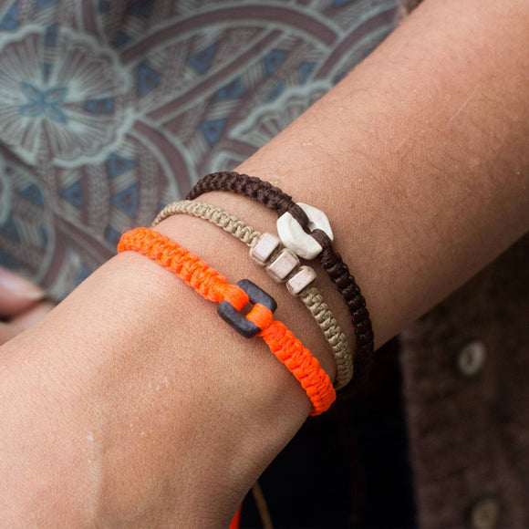Black Raymi Crayola Orange bracelets that fight poverty cover