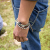 Black Tinkus Arabic Camel donation bracelets on wrist