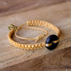 Black Wayta Gold Mustard fair trade bracelets on wood