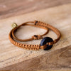 Black Wayta Sweet Caramel fair trade bracelets on wood