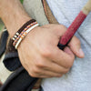 White Chasqui Chocolate Brown bracelets that help children on wrist