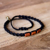 Brown Misky Carbon Black hippie bracelets on wood