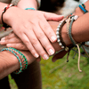 White Tinkus Olive Green donation bracelets lifestyle