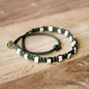 White Andes Military Green macrame artisan bracelets on wood