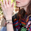 White Chasqui Wine Purple bracelets that help children lifestyle