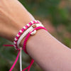 White Rustic Candy Pink handmade ethnic bracelets on wrist