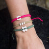 White Rustic Strawberry Pink handmade ethnic bracelets on wrist