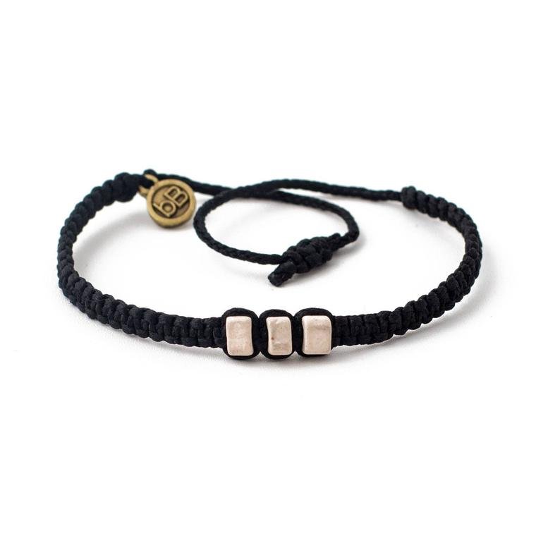 White Chasqui Carbon Black bracelets that help children cover