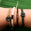 Black Wayta Gold Mustard fair trade bracelets on wrist